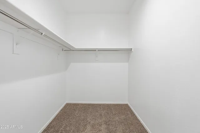 a bathroom with a sink toilet vanity and shower