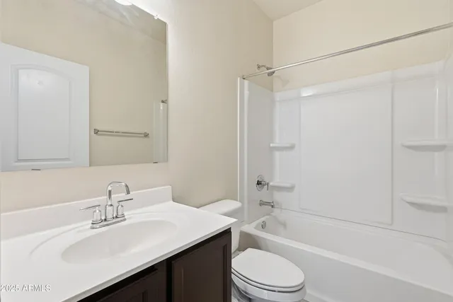 a bathroom with a sink double vanity and a mirror