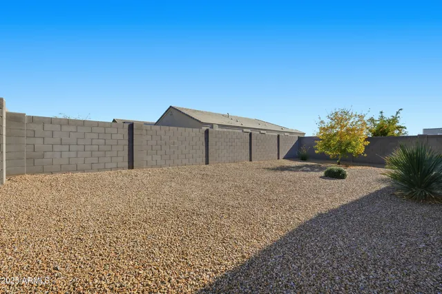 a view of outdoor space with garden and trees