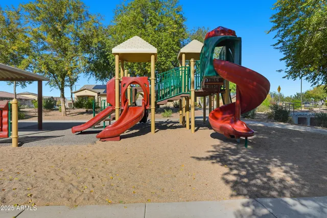 a view of a park with swings and a table