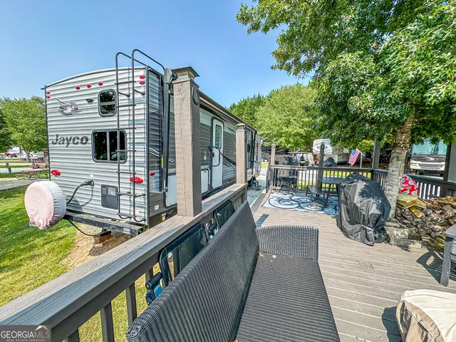 a balcony view with a seating space
