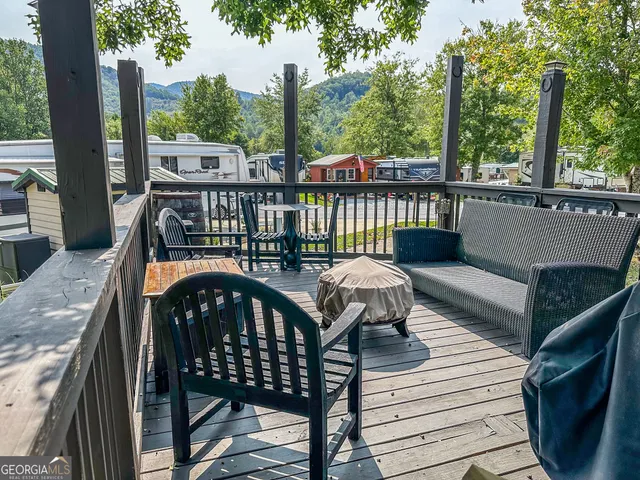 a view of a deck with two chairs and a table