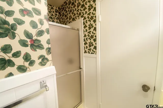 a bathroom with a shower curtain and a sink