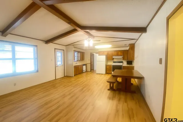 a view of a living room filled with furniture