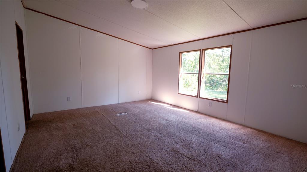 1550 East Orlando Road Orlando, FL 32820 - Photo 14 of 27 an empty room with windows