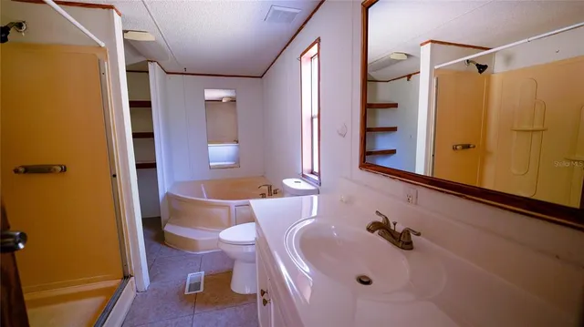 a kitchen with a sink a stove and a window