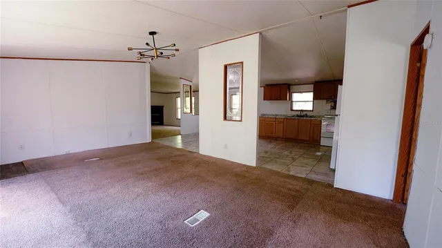a kitchen with a stove sink and microwave