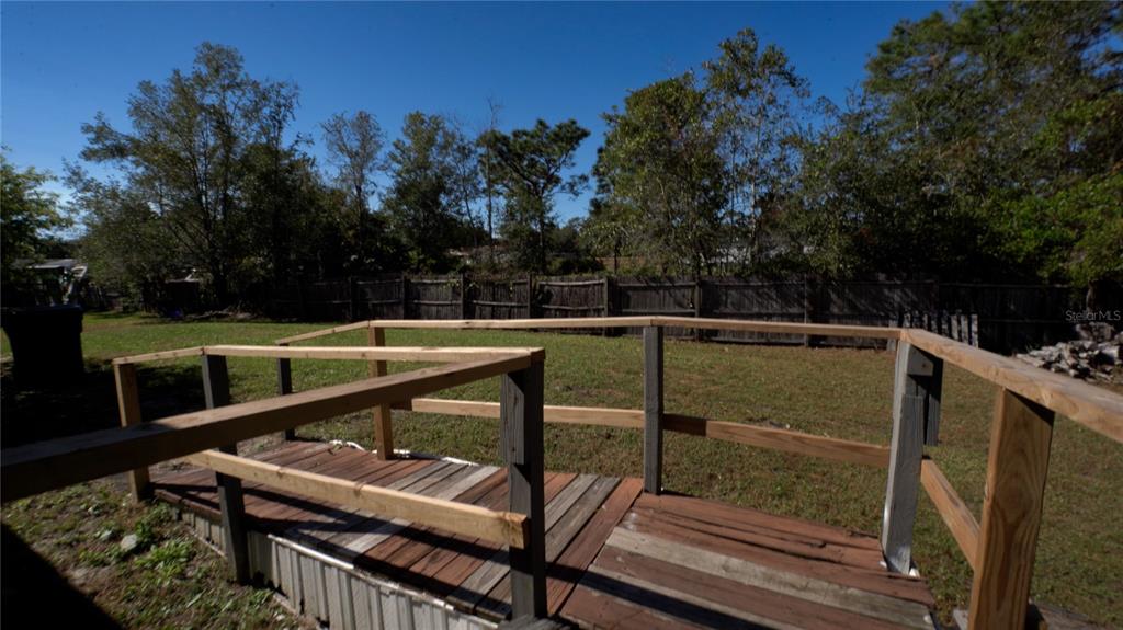 1550 East Orlando Road Orlando, FL 32820 - Photo 23 of 27 a view of outdoor space with outdoor seating and green space