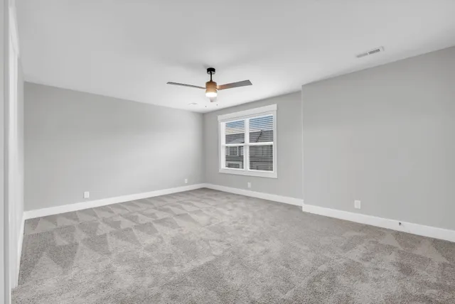 a bathroom with a sink a toilet a mirror and shower