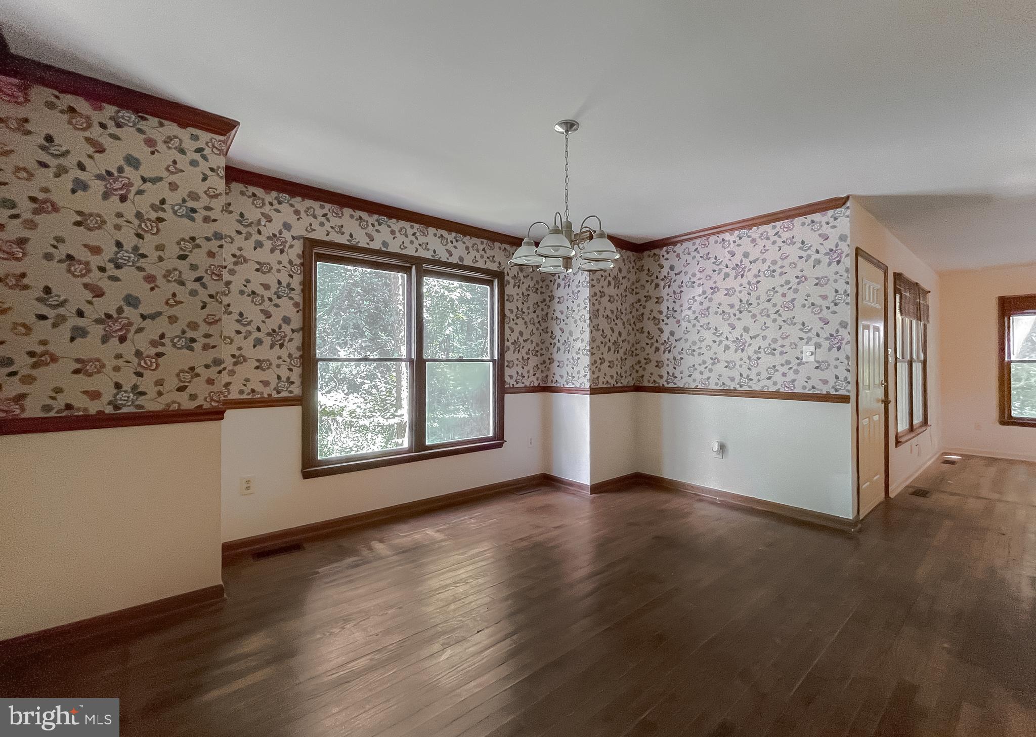 960 Bowie Shop Road Huntingtown, MD 20639 - Photo 13 of 69 wooden floor in an empty room with a window