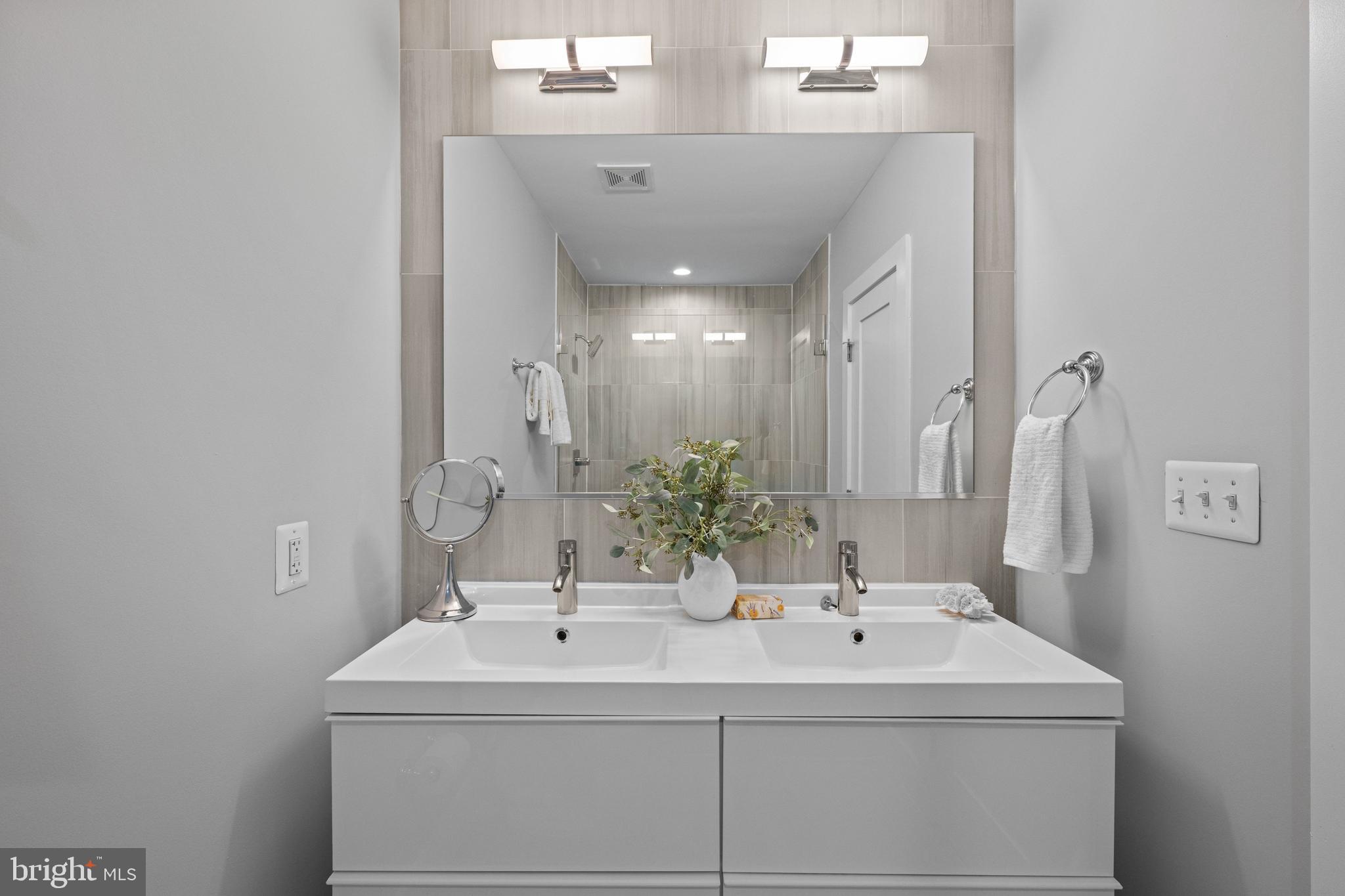 1124 4th Street Northeast Washington, DC 20002 - Photo 15 of 34 a bathroom with a sink and a mirror