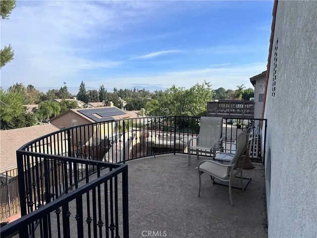 a view of a balcony with furniture
