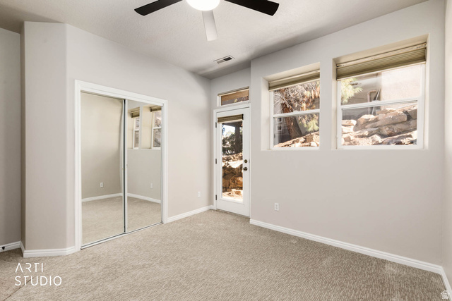 2158 Balboa Way St. George, UT 84770 - Photo 26 of 40 Unfurnished bedroom featuring a closet, carpet floors, and ceiling fan