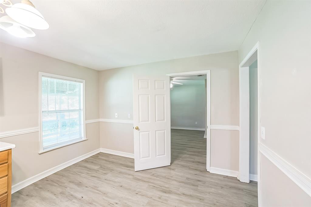 2861 Fm 727 Jefferson, TX 75657 - Photo 11 of 35 an empty room with wooden floor and windows