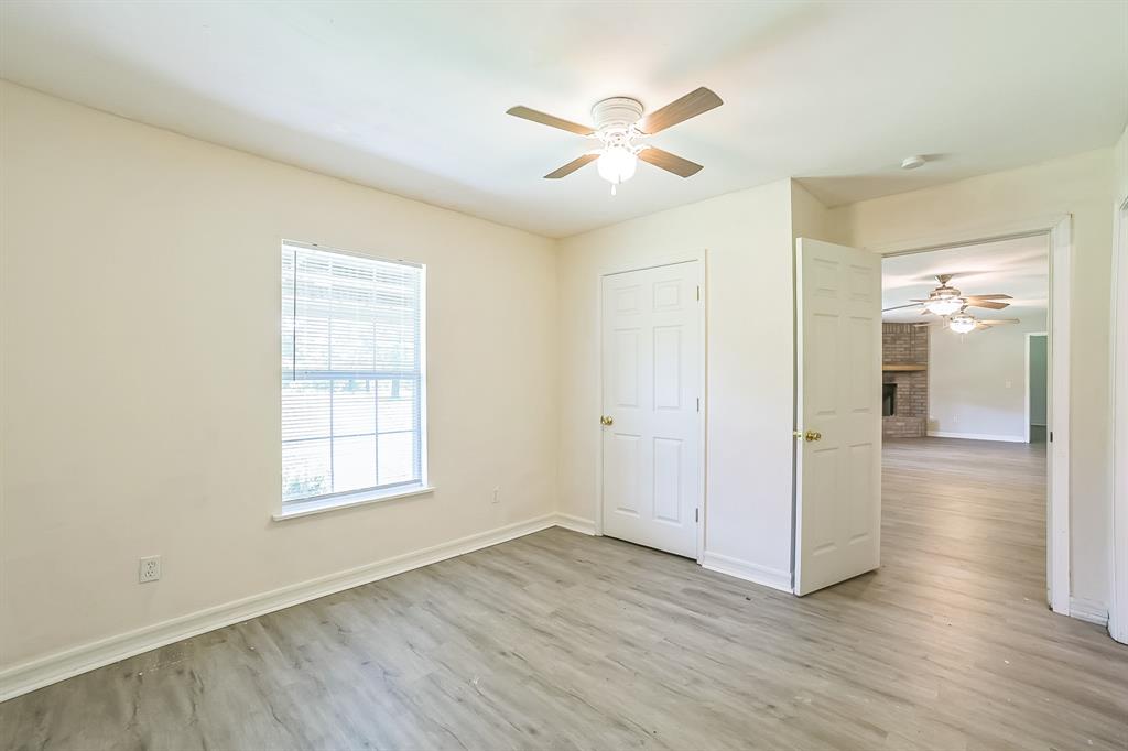 2861 Fm 727 Jefferson, TX 75657 - Photo 19 of 35 wooden floor in an empty room with a window