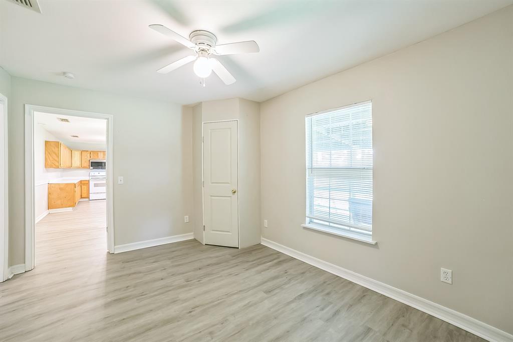 2861 Fm 727 Jefferson, TX 75657 - Photo 28 of 35 wooden floor in an empty room with a window