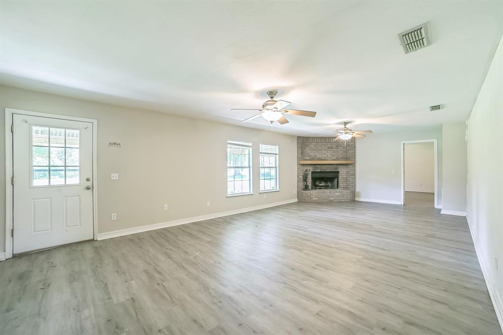 2861 Fm 727 Jefferson, TX 75657 - Photo 8 of 35 a view of an empty room with wooden floor and a window