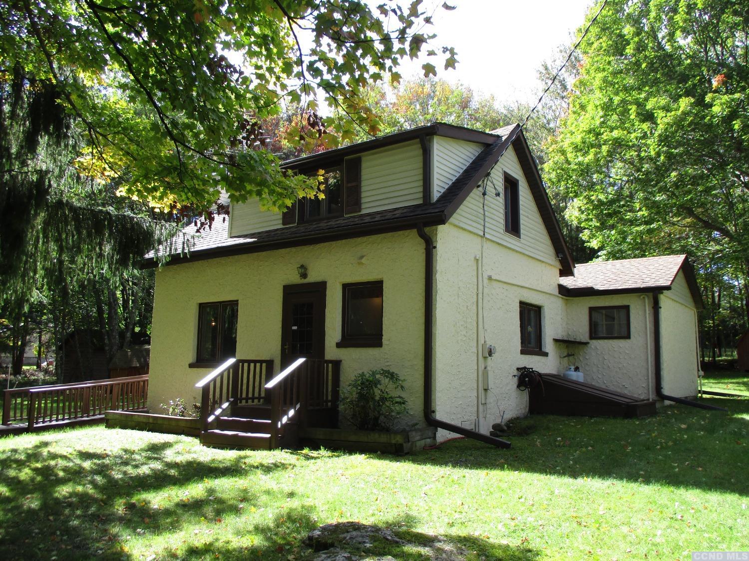 95 Reme Road Prattsville, NY 12468 - Photo 1 of 24 a view of a backyard with a small cabin