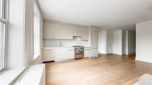 a kitchen with a stove a sink and a refrigerator