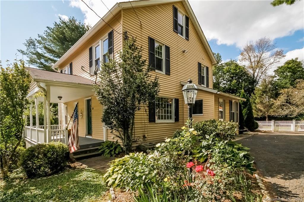 20 Park Lane Ridgefield, CT 06877 - Photo 1 of 1 a front view of a house with garden