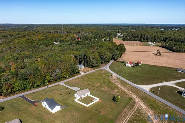 an aerial view of a house with a outdoor space
