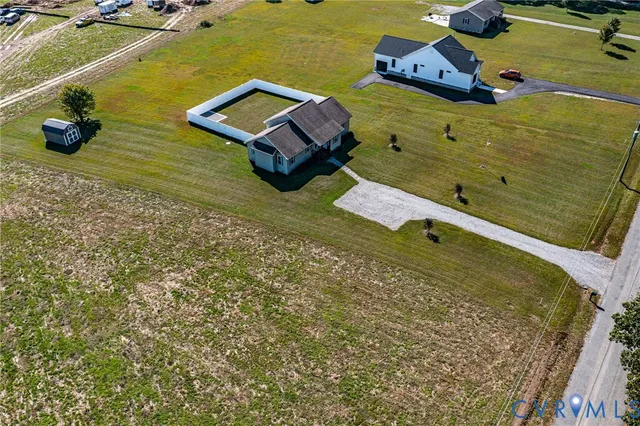 a aerial view of a house with a lake view
