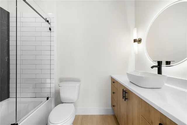 a bathroom with a shower and a mirror