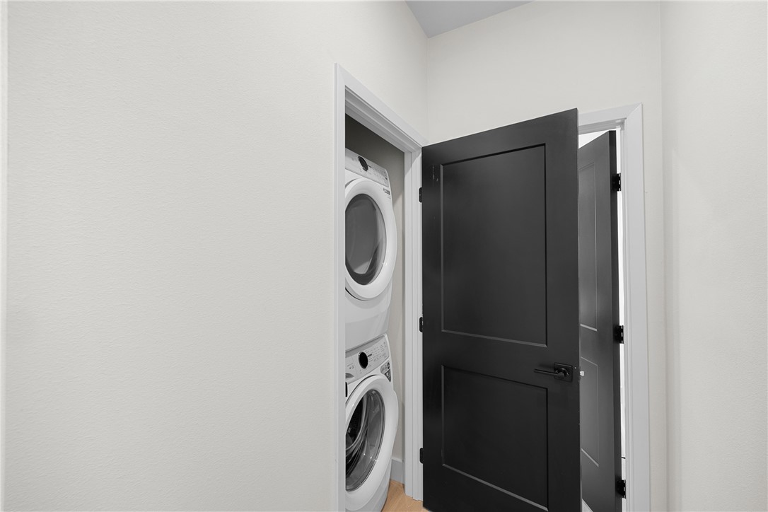 2539 East Villa Maria Road, Unit D Bryan, TX 77802 - Photo 18 of 37 a close view of a utility room with dryer and washer