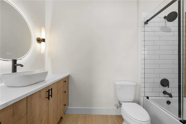 a bathroom with a shower and a bath tub