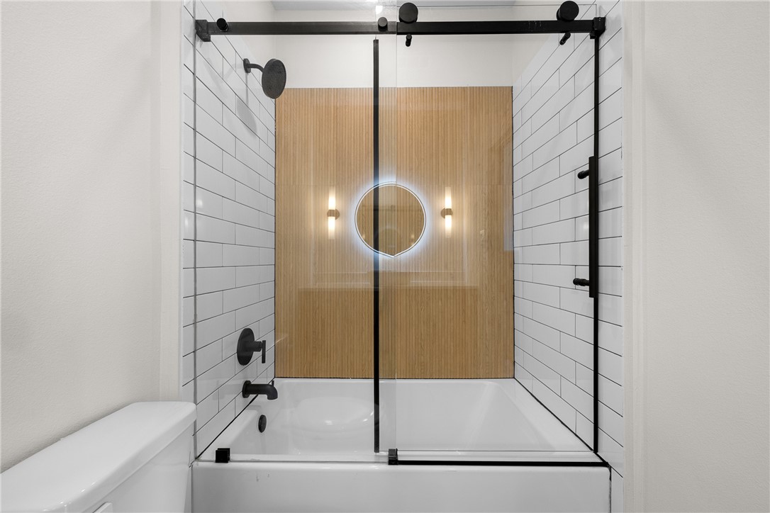 2539 East Villa Maria Road, Unit D Bryan, TX 77802 - Photo 22 of 37 a bathroom with a shower and a bath tub