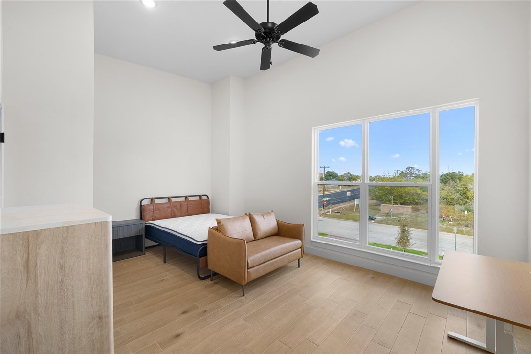 2539 East Villa Maria Road, Unit D Bryan, TX 77802 - Photo 23 of 37 a living room with furniture and a large window