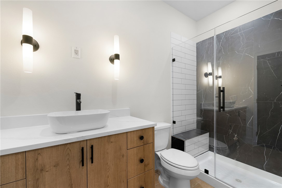 2539 East Villa Maria Road, Unit D Bryan, TX 77802 - Photo 24 of 37 a bathroom with a sink a toilet and shower