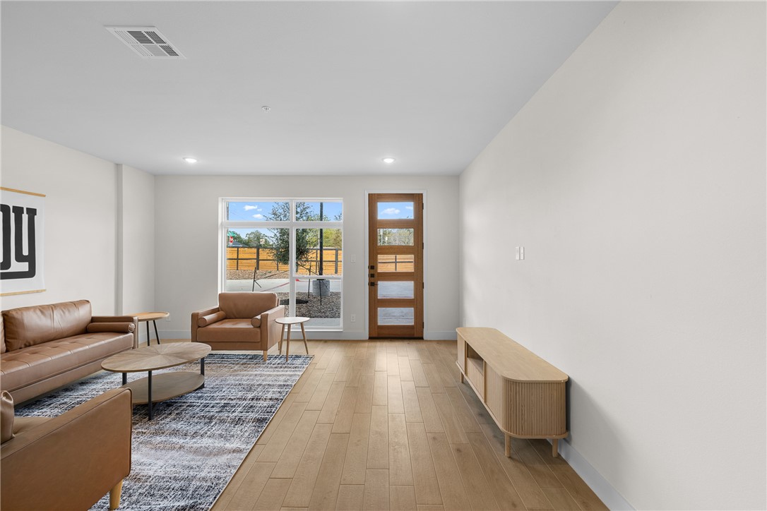 2539 East Villa Maria Road, Unit D Bryan, TX 77802 - Photo 4 of 37 a living room with furniture and a large window