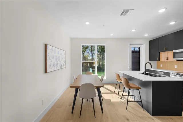 a view of a workspace with furniture and a potted plant