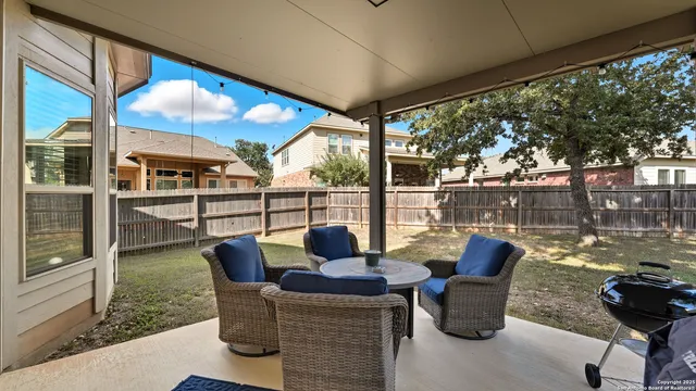 a view of balcony with couch and chairs