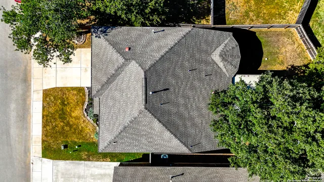 an aerial view of a house with a swimming pool