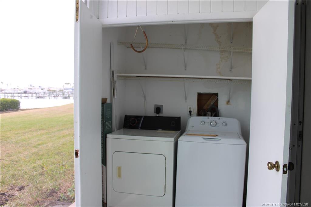 2600 South Kanner Highway, Unit G3 Stuart, FL 34994 - Photo 9 of 13 a utility room with dryer and washer
