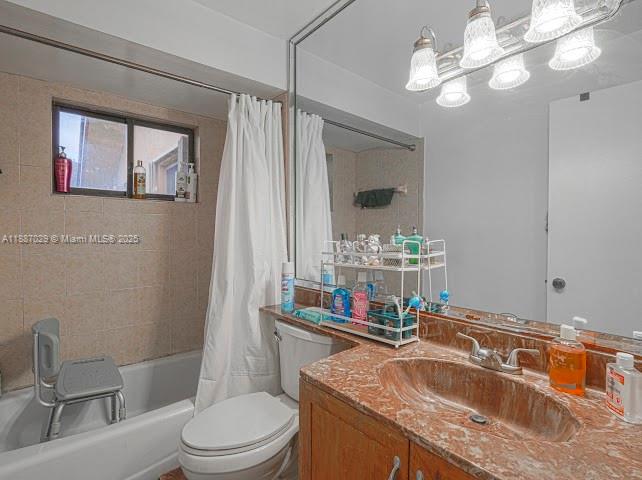 14220 Southwest 109th Street Miami, FL 33186 - Photo 23 of 30 a bath room with a toilet a sink and a mirror