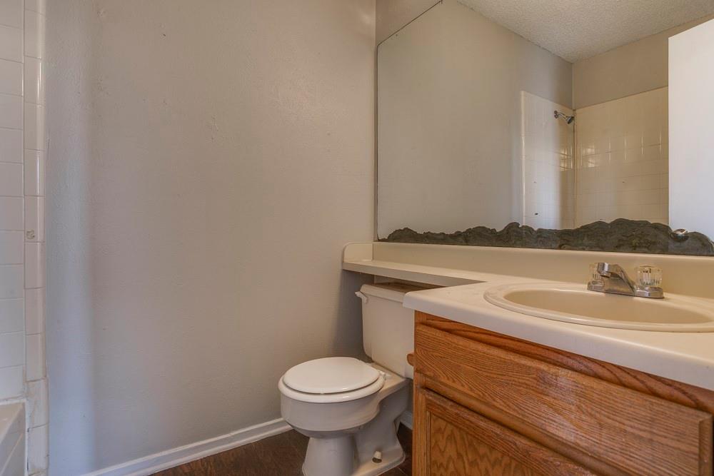10500 Lake June Road Dallas, TX 75217 - Photo 10 of 11 a bathroom with a sink and a toilet