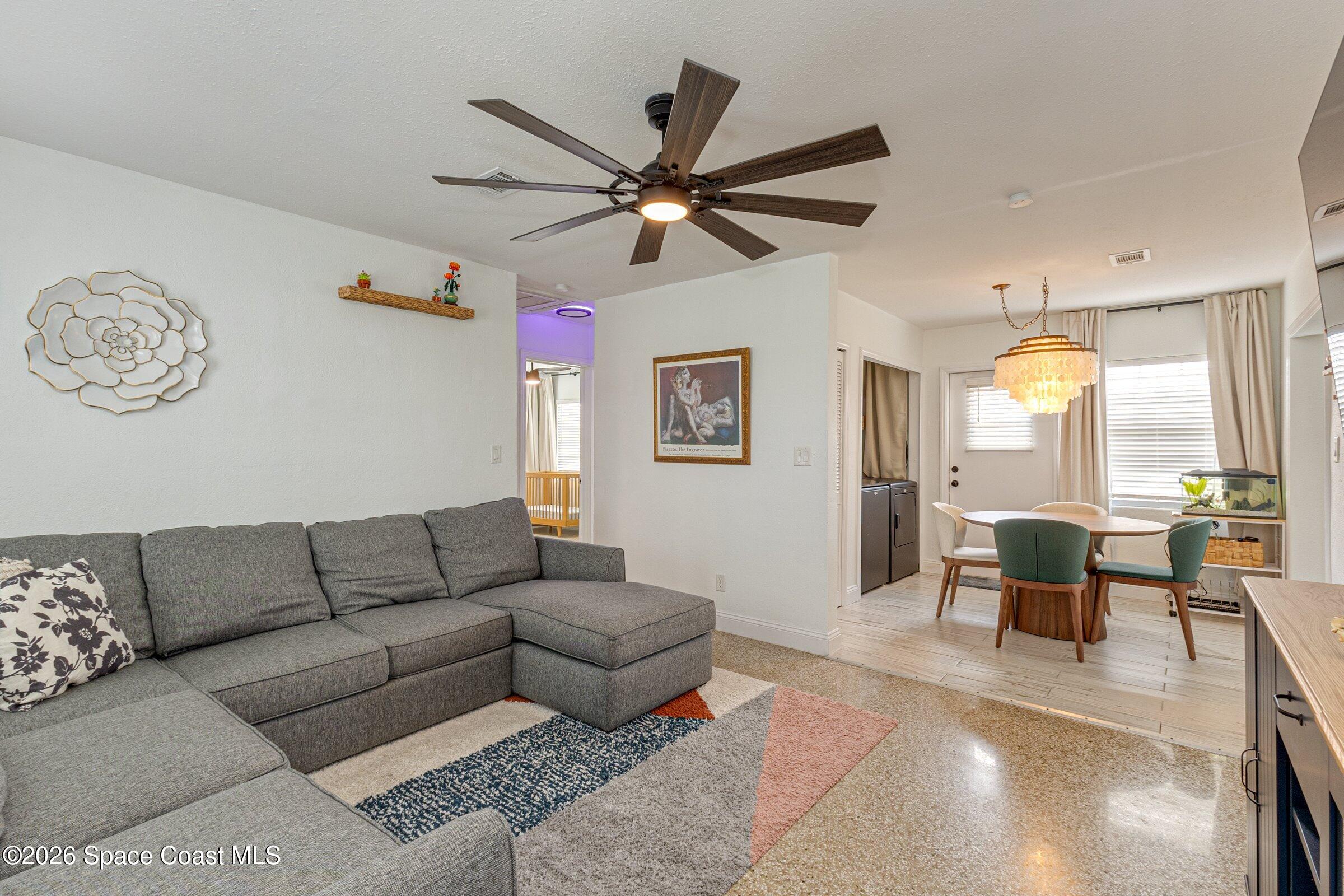131 Delmar Street Indialantic, FL 32903 - Photo 13 of 29 a living room with furniture and a large window