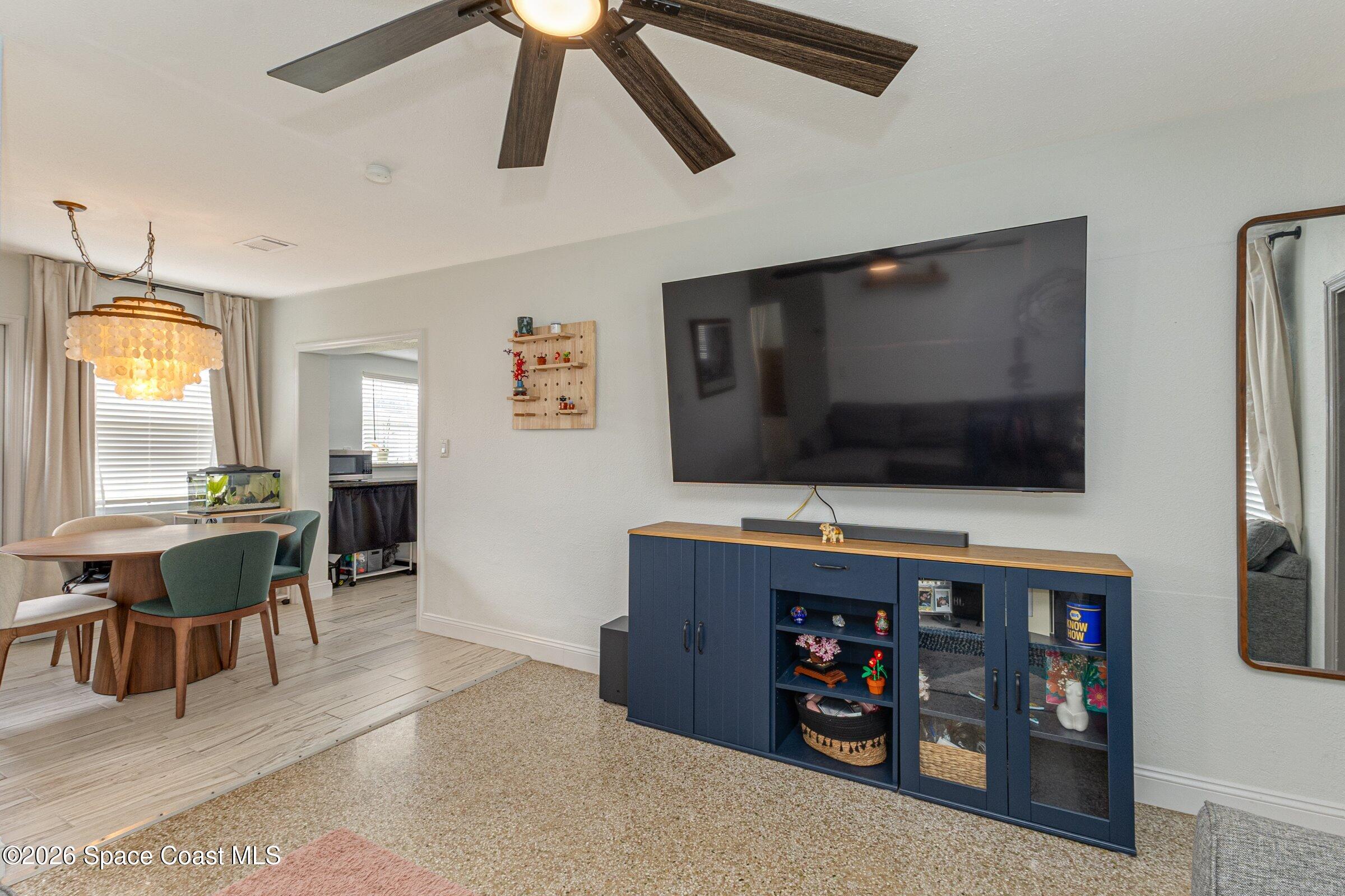 131 Delmar Street Indialantic, FL 32903 - Photo 14 of 29 a living room with furniture and a flat screen tv