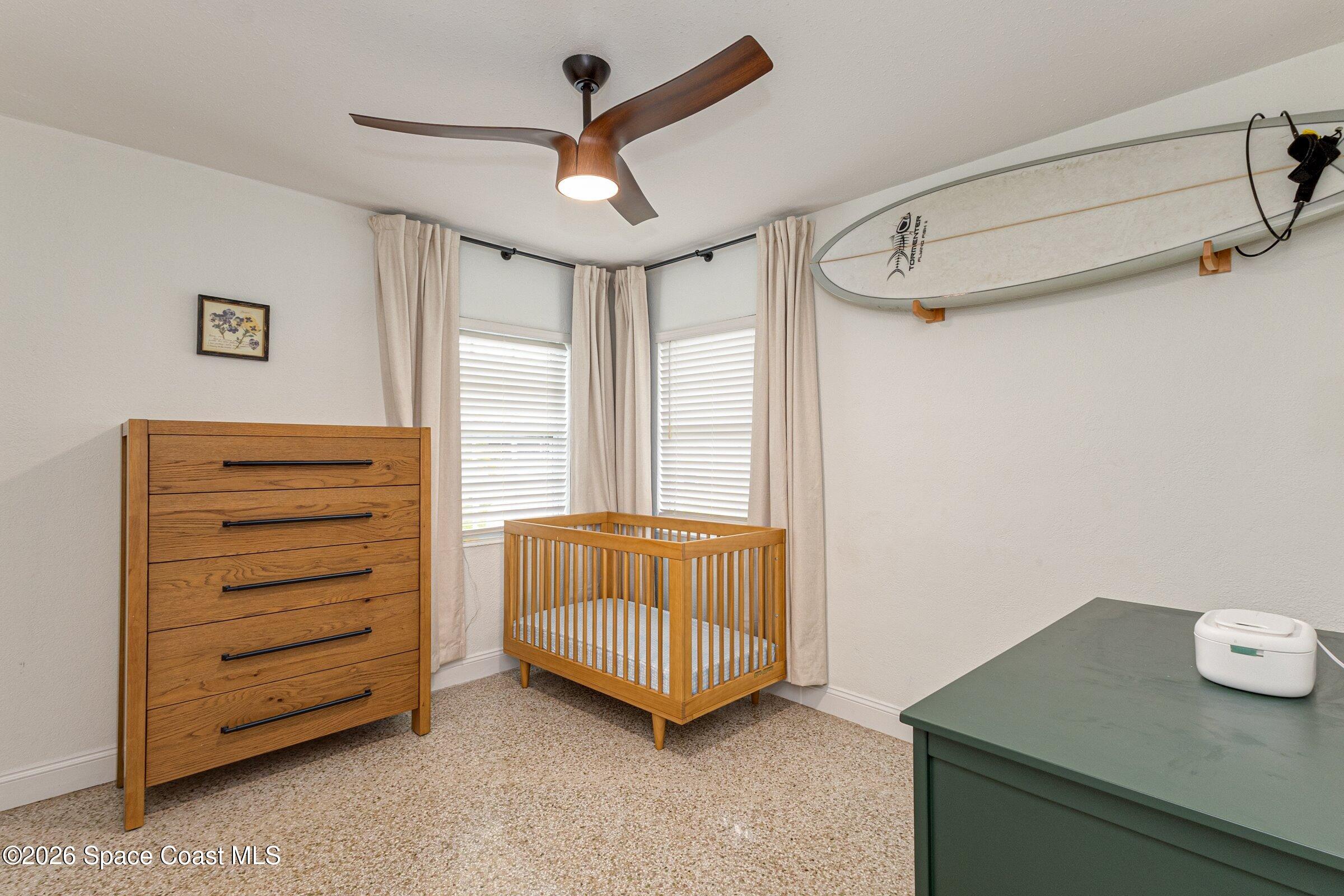 131 Delmar Street Indialantic, FL 32903 - Photo 19 of 29 a living room with furniture and a ceiling fan