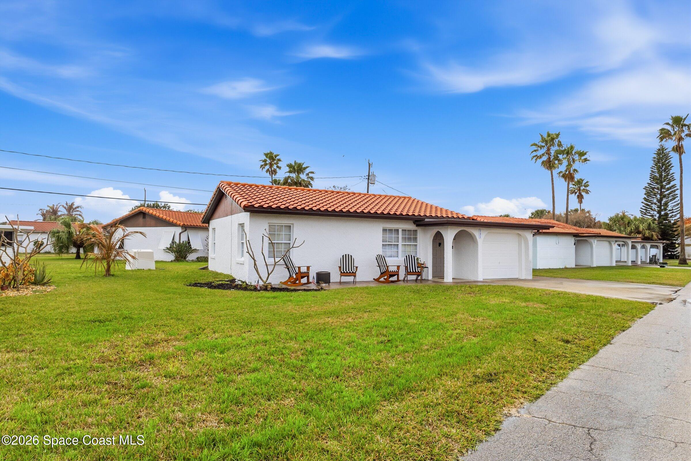 131 Delmar Street Indialantic, FL 32903 - Photo 2 of 29 a view of a house with a yard