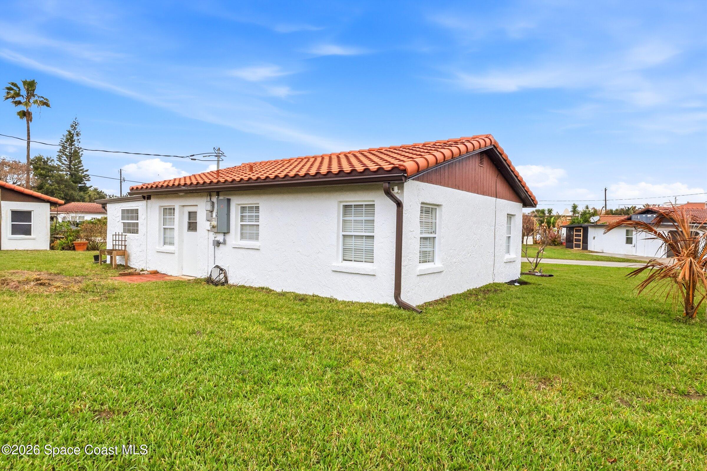 131 Delmar Street Indialantic, FL 32903 - Photo 23 of 29 a view of a house with backyard