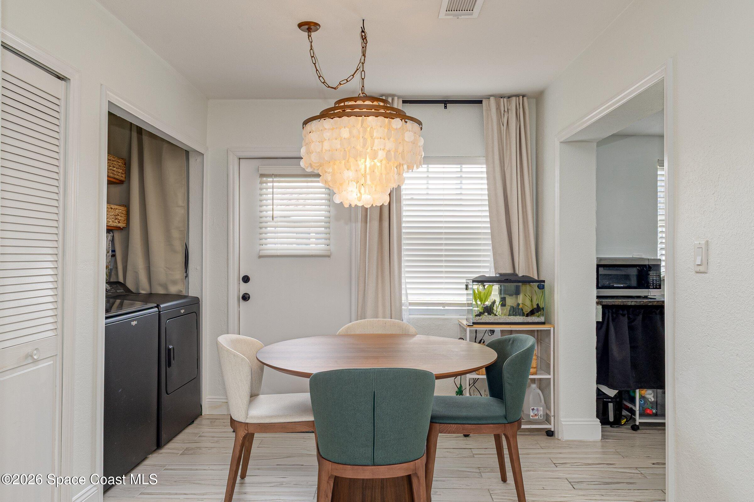 131 Delmar Street Indialantic, FL 32903 - Photo 8 of 29 a dining room with furniture and window