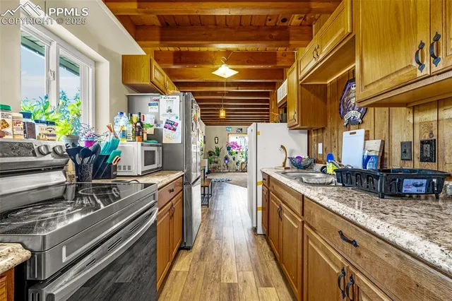 a kitchen with stove and flowers