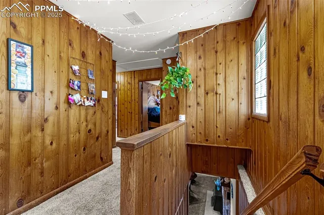 a view of a door with wooden walls