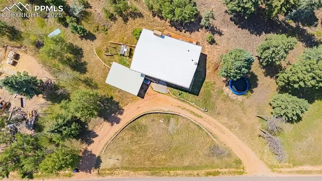an aerial view of a house with a swimming pool
