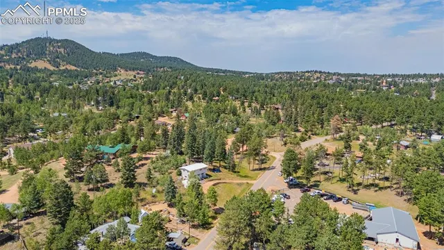 a view of a city with mountains in the background