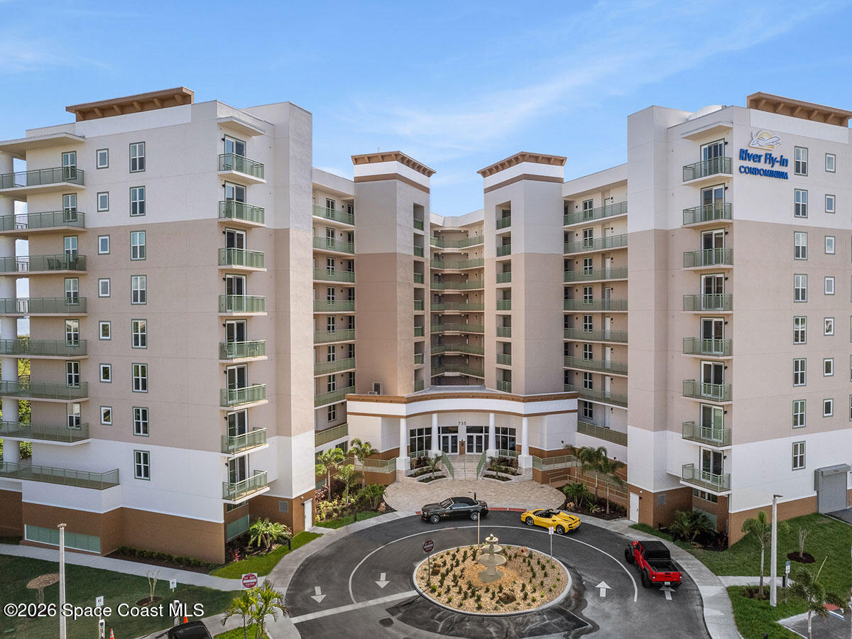 735 Pilot Lane, Unit 503 Merritt Island, FL 32952 - Photo 1 of 26 a front view of a building with outdoor seating